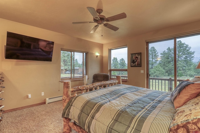 carpeted bedroom featuring baseboard heating, ceiling fan, and access to outside