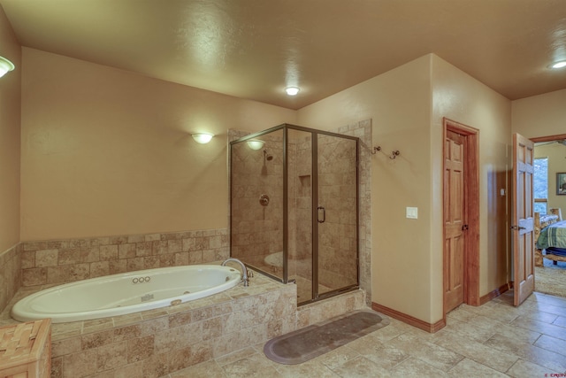 bathroom featuring separate shower and tub