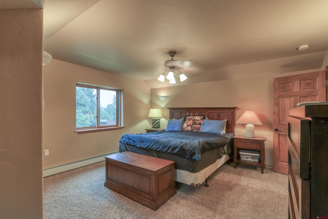 carpeted bedroom featuring ceiling fan, vaulted ceiling, and a baseboard heating unit