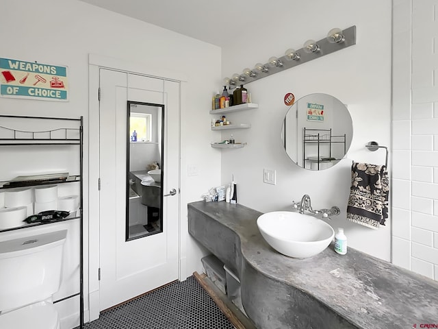 bathroom featuring tile patterned floors, sink, and toilet