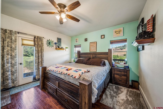 bedroom featuring ceiling fan, baseboards, access to exterior, and dark wood-style flooring