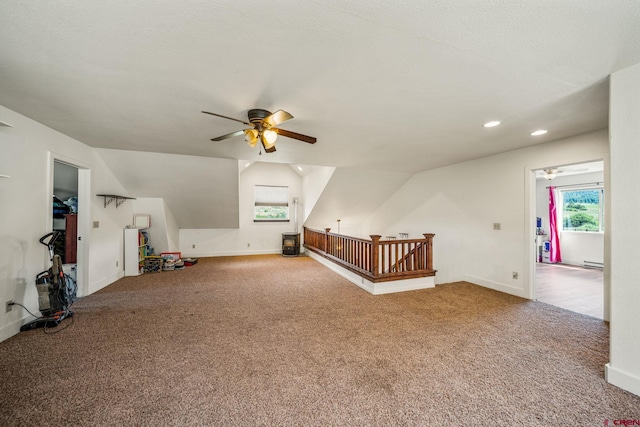 bonus room featuring baseboards, lofted ceiling, carpet floors, recessed lighting, and a ceiling fan