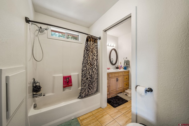 bathroom featuring shower / bath combo with shower curtain, vanity, and tile patterned flooring