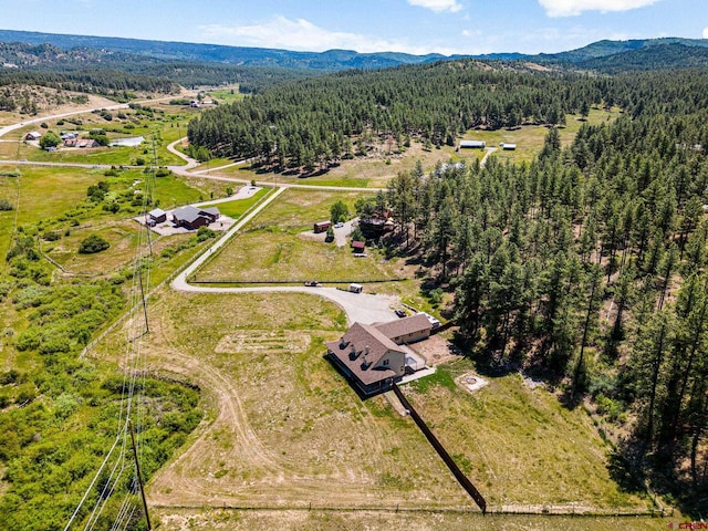 bird's eye view featuring a mountain view and a forest view