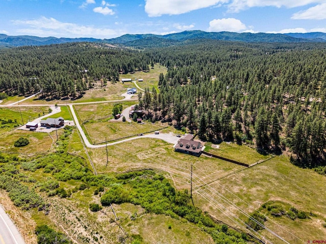 aerial view with a view of trees and a mountain view