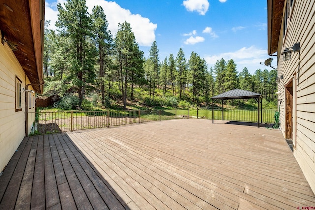 wooden deck featuring a gazebo