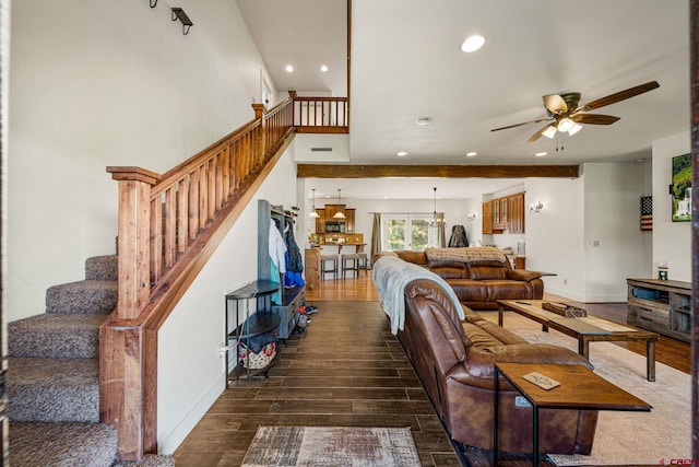 living room with stairs, ceiling fan with notable chandelier, recessed lighting, and wood finished floors