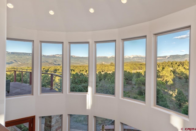 sunroom / solarium featuring a mountain view