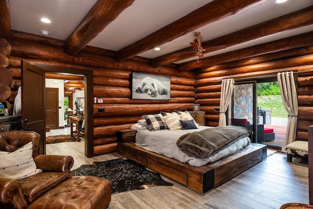 bedroom featuring access to exterior and rustic walls