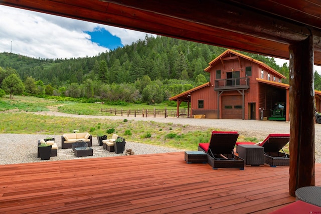 wooden terrace featuring an outdoor hangout area