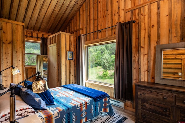 bedroom featuring hardwood / wood-style flooring, wood walls, vaulted ceiling, and a baseboard heating unit