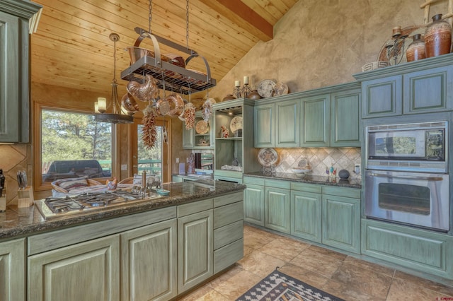 kitchen featuring appliances with stainless steel finishes, wood ceiling, an inviting chandelier, high vaulted ceiling, and beamed ceiling