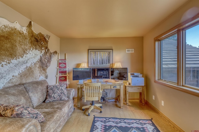 home office with light wood-type flooring