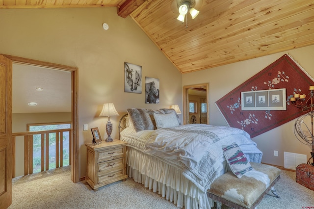 carpeted bedroom with vaulted ceiling with beams, ceiling fan, and wood ceiling