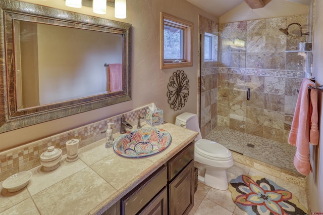 bathroom featuring tile patterned floors, walk in shower, vanity, vaulted ceiling, and toilet