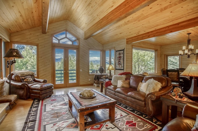 living room with french doors, wooden ceiling, lofted ceiling with beams, a notable chandelier, and light hardwood / wood-style floors