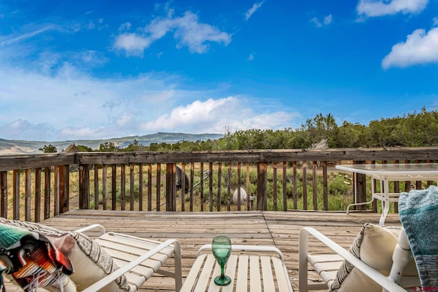 wooden terrace with a mountain view