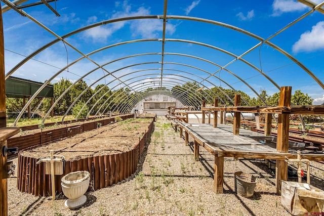 view of property's community with a vegetable garden