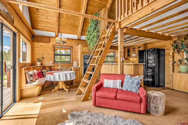 living room with wood walls and beam ceiling