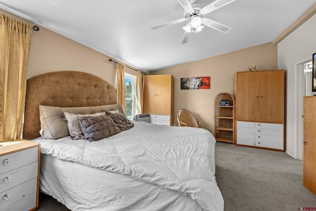 bedroom featuring carpet flooring, ceiling fan, and vaulted ceiling