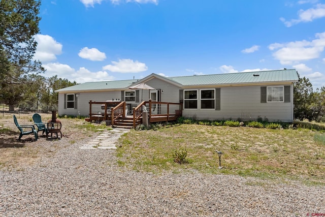 view of front of home with a deck