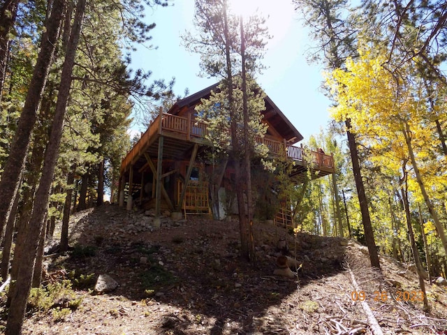 view of home's exterior featuring a deck