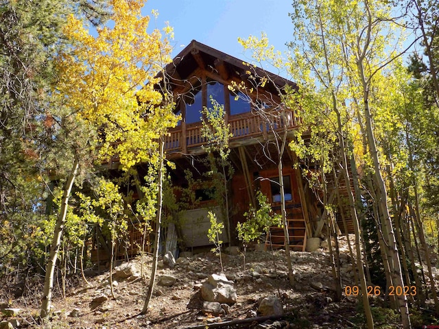 rear view of property with a balcony