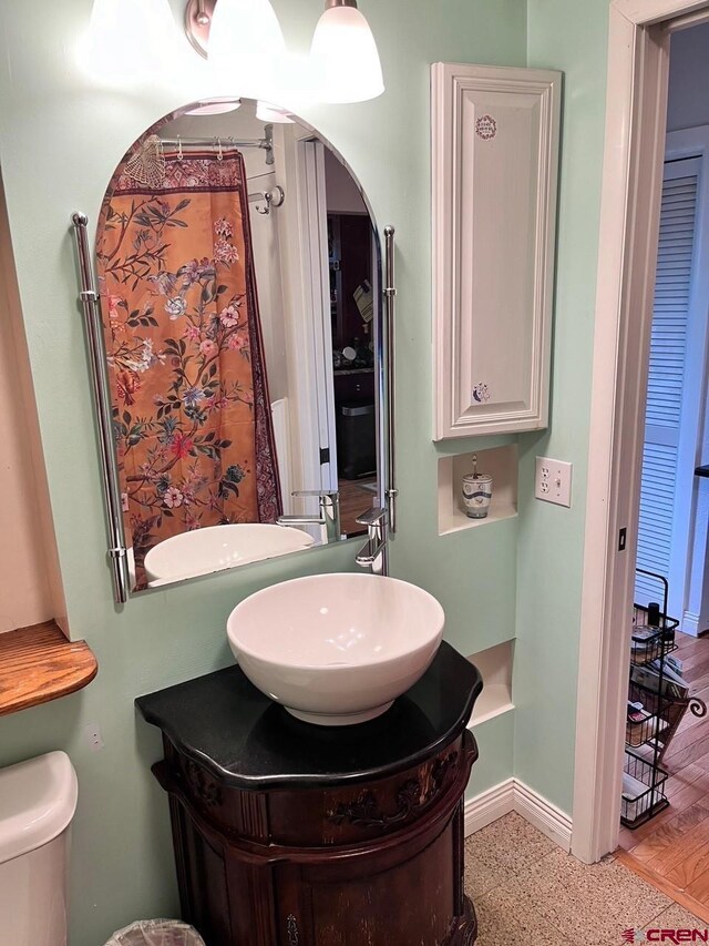 bathroom with vanity and toilet