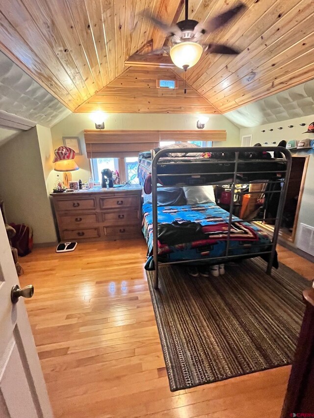 bedroom featuring wood ceiling, lofted ceiling, wood-type flooring, and ceiling fan