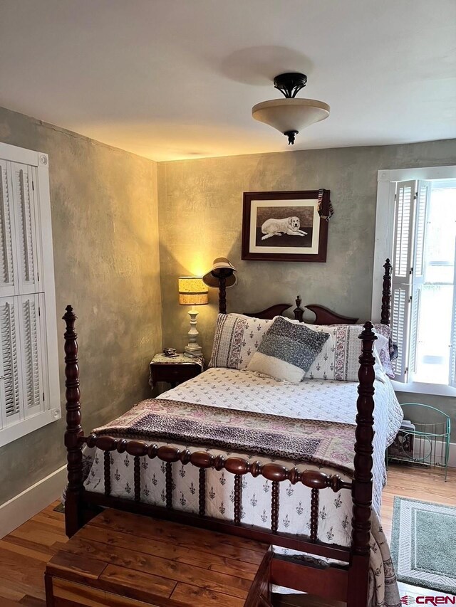 bedroom with wood-type flooring