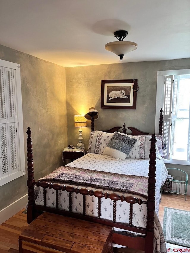 bedroom with wood finished floors