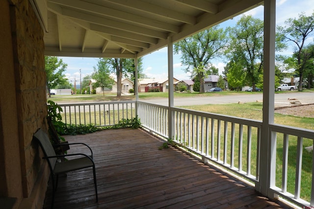 wooden deck featuring a yard