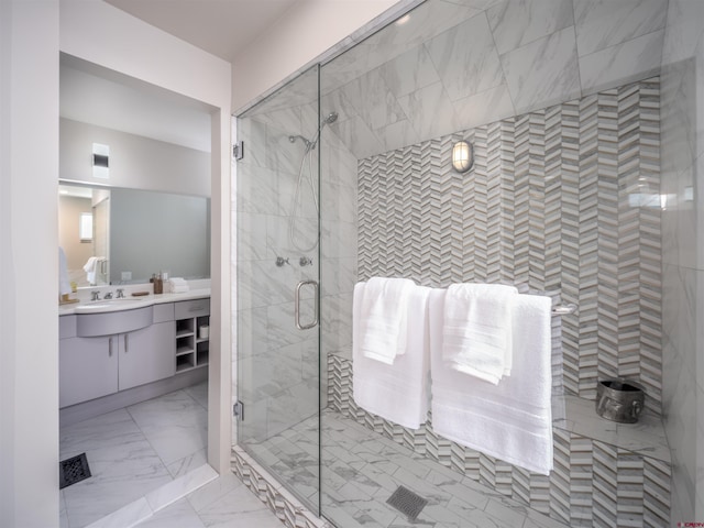 bathroom featuring vanity and an enclosed shower