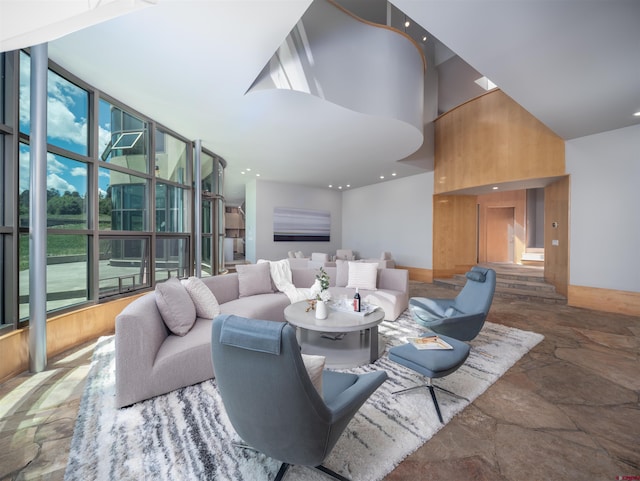 living room featuring expansive windows and a high ceiling