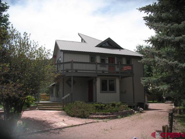 view of front facade with a balcony