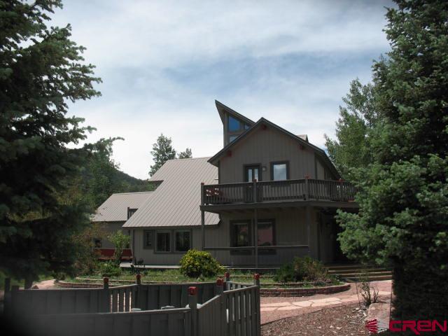 view of front of home featuring a balcony