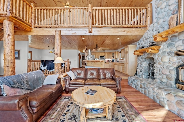 living room with wood ceiling, ceiling fan, and hardwood / wood-style floors