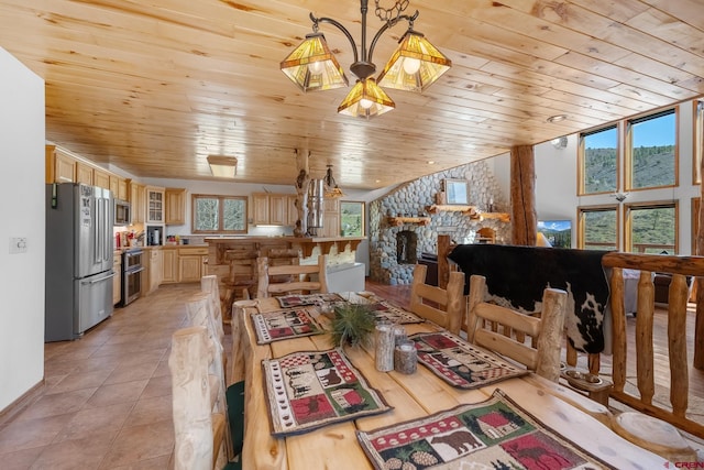 tiled dining room featuring a wealth of natural light and wooden ceiling