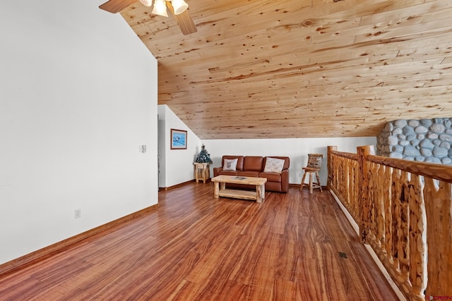 living area with vaulted ceiling, hardwood / wood-style floors, ceiling fan, and wooden ceiling