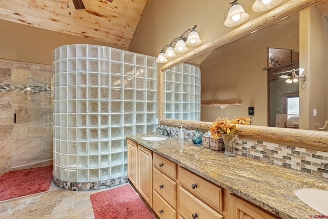 26 Severn Peak Rd, Bayfield, CO 81122 - full bathroom with a ceiling fan, vaulted ceiling, double vanity, wooden ceiling, and walk in shower