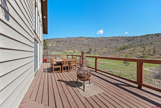 26 Severn Peak Rd, Bayfield, CO 81122 - deck featuring an outdoor fire pit, a mountain view, and outdoor dining area