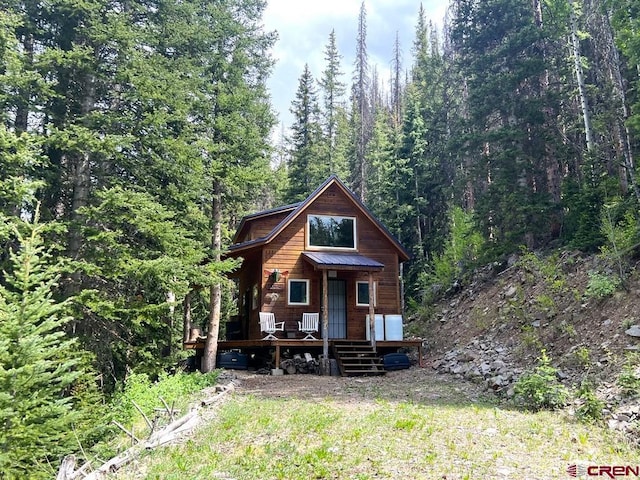 view of log cabin