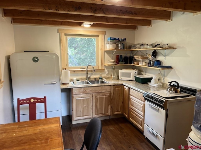 kitchen with sink, white appliances, dark hardwood / wood-style floors, light brown cabinetry, and beamed ceiling