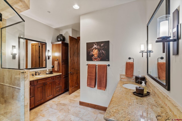 bathroom featuring vanity and an enclosed shower