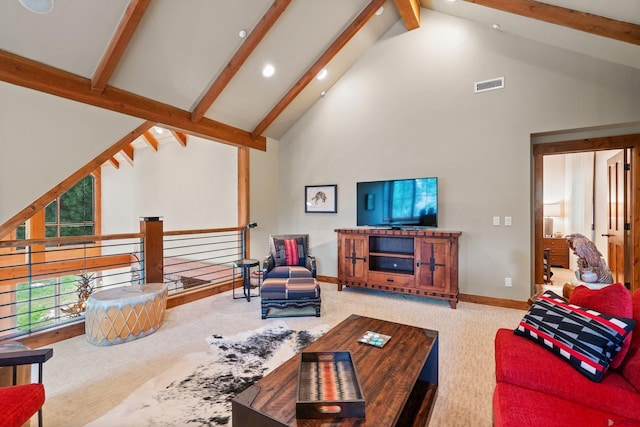 carpeted living room featuring beam ceiling and high vaulted ceiling