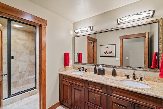 bathroom featuring vanity and a shower with door