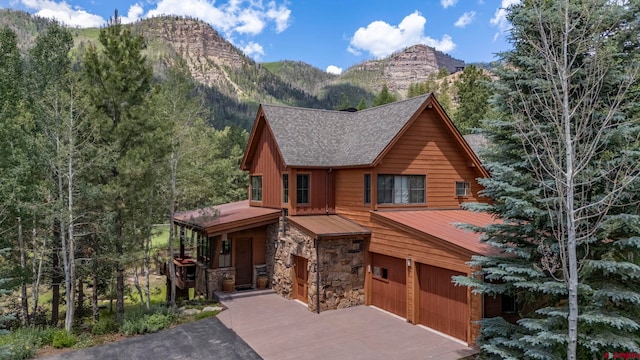 view of front of house featuring a garage and a mountain view