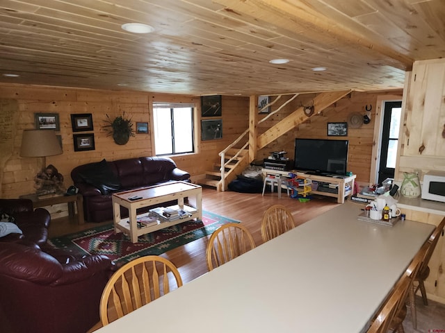 living room featuring wood ceiling, wooden walls, and hardwood / wood-style flooring