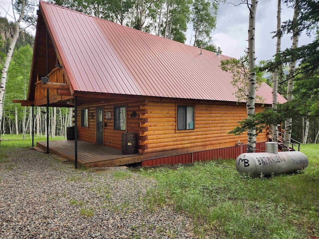 exterior space featuring a wooden deck