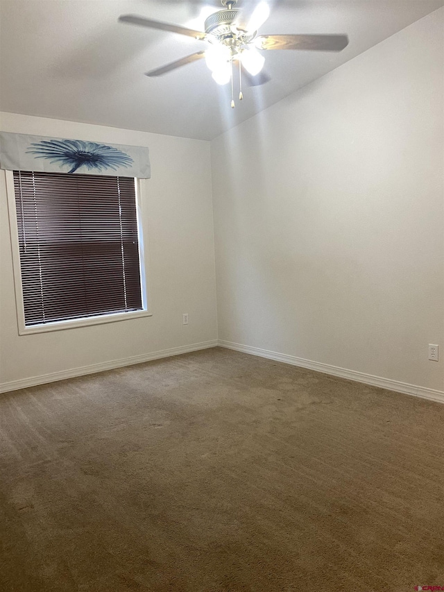 unfurnished room featuring ceiling fan and carpet floors